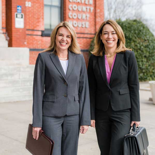Carolyn-Peacock-and-Karen-Alexander-Family-Law-Attorneys-outside-Craven-County-Courthouse